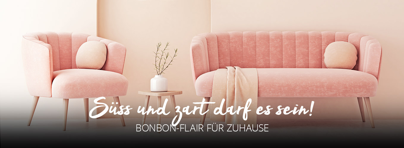 Süß und zart darf es sein! Bonbon-Flair für zuhause - Rosa Sofa mit pastellfarbenen Kissen und Decke, dazu passender Sessel