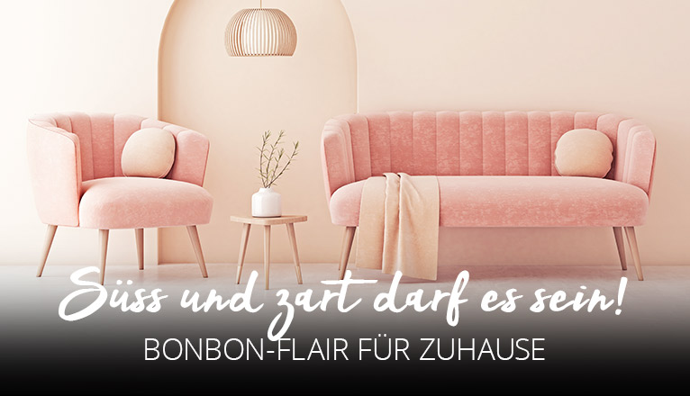 Süß und zart darf es sein! Bonbon-Flair für zuhause - Rosa Sofa mit pastellfarbenen Kissen und Decke, dazu passender Sessel
